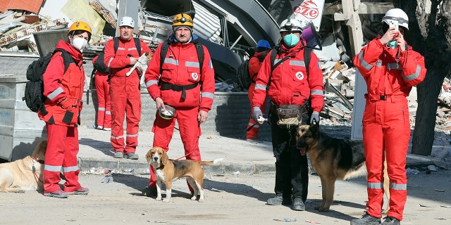 Romanian rescuers appear near destroyed buildings after twin earthquakes hit Turkiye's Hatay on Feb. 14, 2023. On Feb. 6, one earthquake with a magnitude of 7.7 was felt in the Pazarcik district, affecting Kahramanmaras and multiple provinces: Gaziantep, Sanliurfa, Diyarbakir, Adana, Adiyaman, Malatya, Osmaniye, Hatay, and Kilis. At 13.24 p.m. (1024GMT), a magnitude of 7.6 earthquake was felt in Kahramanmaras' Elbistan district.