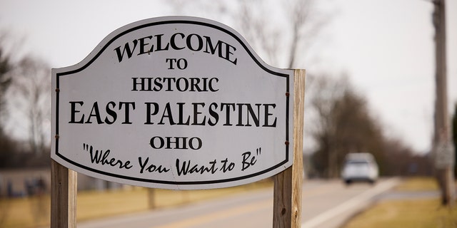 A sign welcomes visitors to the town of East Palestine on February 14, 2023, in East Palestine, Ohio. 
