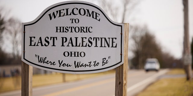 A sign welcomes visitors to the town of East Palestine on February 14, 2023 in East Palestine, Ohio. A train operated by Norfolk Southern derailed on February 3, releasing toxic fumes and forcing evacuation of residents. 