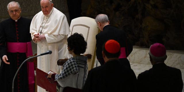 Pope Francis, assisted by Prefect of the Pontifical House Monsignor Leonardo Sapienza, presides over the weekly general audience on Feb. 15, 2023, at Paul-VI hall in The Vatican.