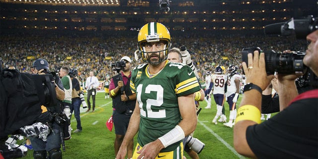 Packers quarterback Aaron Rodgers walks off the field after defeating the Chicago Bears, 27-10, on September 18, 2022 at Lambeau Field in Green Bay, Wisconsin.