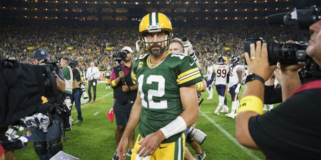 Packers quarterback Aaron Rodgers walks off the field after defeating the Chicago Bears, 27-10, on September 18, 2022 at Lambeau Field in Green Bay, Wisconsin.