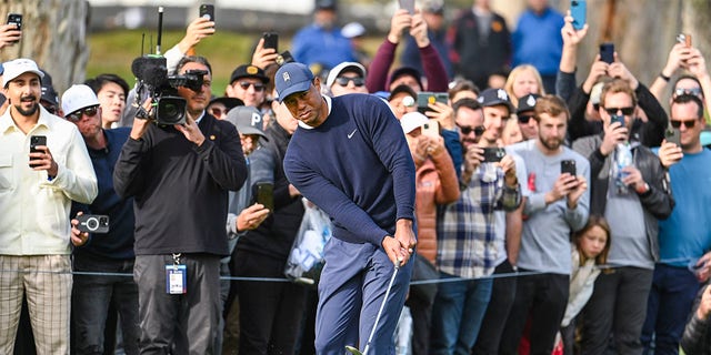 Tiger Woods chips a shot during the Genesis Invitational at Riviera Country Club on Feb. 16, 2023, in Pacific Palisades, California.