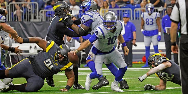 A. J. McCarron.  Number 10 of the St. Louis Battlehawks fights against the San Antonio Brahamas at the Alamodome on February 19, 2023 in San Antonio.