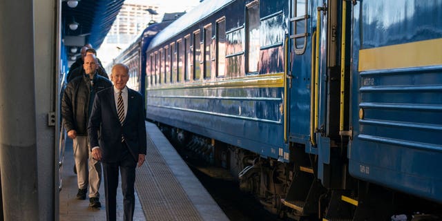 US President Joe Biden walks along the train platform after a surprise visit to meet with Ukrainian President Volodymyr Zelenskyy, in Kyiv on February 20, 2023. 