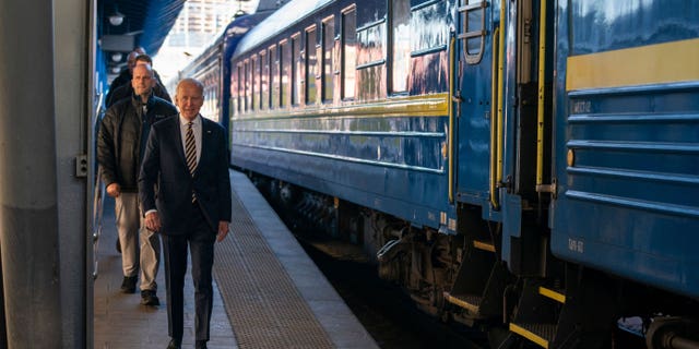 US President Joe Biden walks along the train platform after a surprise visit to meet with Ukrainian President Volodymyr Zelenskyy, in Kyiv on February 20, 2023. 