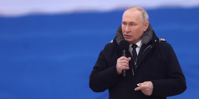Russian President Vladimir Putin speaks during a concert in Luzhniki Stadium on February 22, 2023, in Moscow, Russia. 