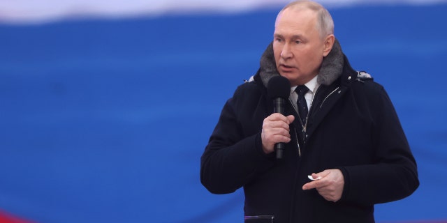 Russian President Vladimir Putin speaks during a concert in Luzhniki Stadium on February 22, 2023, in Moscow, Russia. 