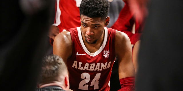 Brandon Miller, #24, listens to  Alabama Crimson Tide head Coach Nate Oats during a timeout during a basketball game against the South Carolina Gamecocks on Feb. 22, 2023 at Colonial Life Arena in Columbia, South Carolina.