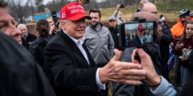 Former President Donald Trump greets supporters during a visit to East Palestine, Ohio, following the Feb. 3 Norfolk Southern freight train derailment, on Feb. 22, 2023.