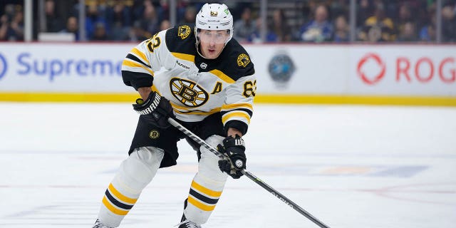 Brad Marchand of the Boston Bruins skates with the puck against the Canucks at Rogers Arena on Feb. 25, 2023, in Vancouver, British Columbia.