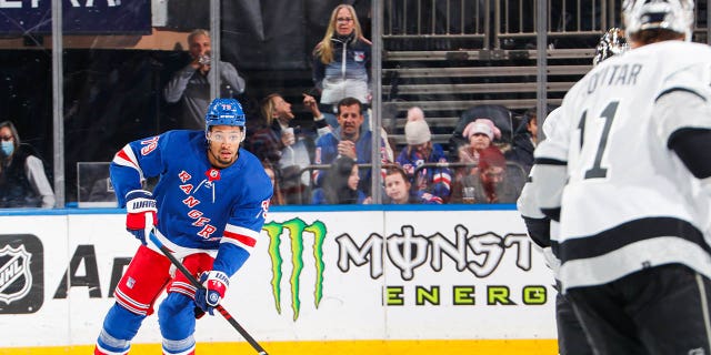 K'Andre Miller, number 79 of the New York Rangers, skates with the puck against the Los Angeles Kings at Madison Square Garden on February 26, 2023 in New York City. 