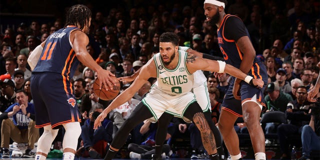 Jayson Tatum of the Boston Celtics plays defense against Jalen Brunson, left, of the New York Knicks on February 27, 2023 at Madison Square Garden.