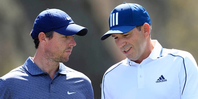 Rory McIlroy, left, speaks with Sergio Garcia during the first round of THE PLAYERS Championship at THE PLAYERS Stadium Course at TPC Sawgrass on March 11, 2021 in Ponte Vedra Beach, Florida. 