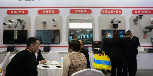 People visit the Hikvision booth during the World Digital Industry Expo on March 24, 2021, in Zhengzhou, China.