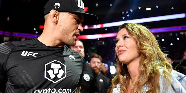 Dustin Poirier kisses his wife Jolie before entering the Octagon during the UFC 264 event at T-Mobile Arena on July 10, 2021 in Las Vegas.