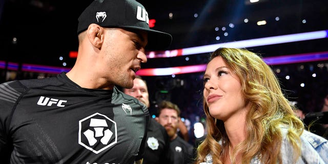 Dustin Poirier kisses his wife Jolie before entering the Octagon during the UFC 264 event at T-Mobile Arena on July 10, 2021 in Las Vegas.
