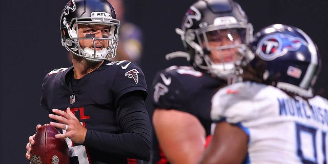 AJ McCarron, #5 of the Atlanta Falcons, looks to pass against the Tennessee Titans during the first half at Mercedes-Benz Stadium on August 13, 2021 in Atlanta.