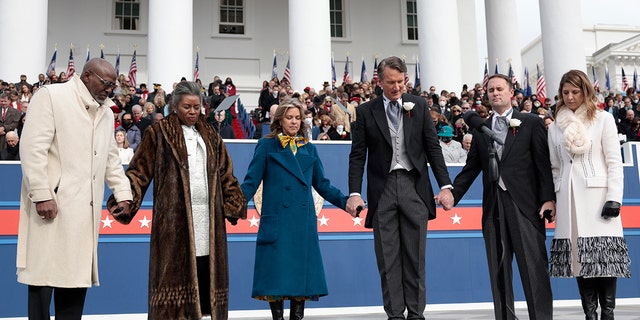 (L-R) Terrence Sears, Virginia Lieutenant Governor Winsome Sears, Suzanne Youngkin, the first lady of Virginia, Virginia Governor Glenn Youngkin, Virginia Attorney General Jason Miyares, and his wife Page Miyares at the State Capitol on January 15, 2022, in Richmond, Virginia. 