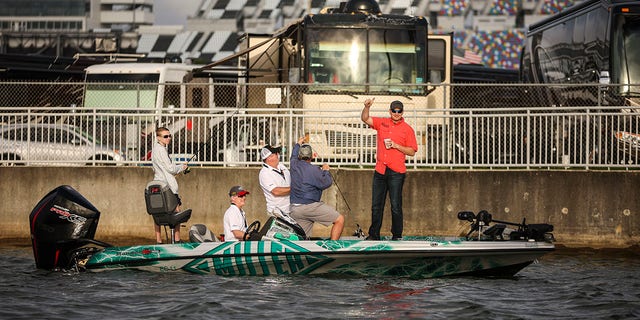NASCAR driver Michael McDowell poses with his team as he competes at the annual Hot Rods &amp; Reels Celebrity Fishing Tournament to benefit The Darrell Gwynn Chapter of The Buoniconti Fund to Cure Paralysis at Daytona International Speedway’s Lake Lloyd, Feb. 18, 2022. Lake Lloyd is named for Saxton Lloyd, a mechanic who gave Bill France Sr. his first job in Daytona.