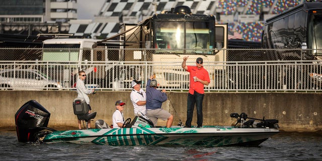 NASCAR driver Michael McDowell poses with his team as he competes at the annual Hot Rods &amp; Reels Celebrity Fishing Tournament to benefit The Darrell Gwynn Chapter of The Buoniconti Fund to Cure Paralysis at Daytona International Speedway’s Lake Lloyd, Feb. 18, 2022. Lake Lloyd is named for Saxton Lloyd, a mechanic who gave Bill France Sr. his first job in Daytona.