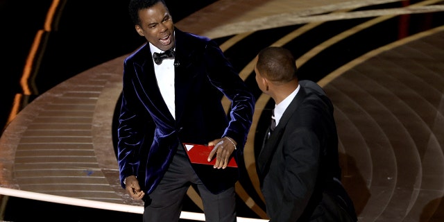 At the 2022 Oscars, Will Smith, right, slapped Chris Rock after the comedian made a joke about Smith's wife, Jada Pinkett Smith, and her bald head. Smith was later banned from the Oscars for 10 years.