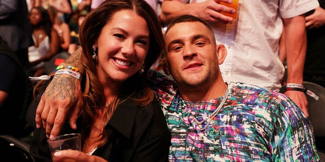 Dustin Poirier and his wife Jolie Poirier attend UFC 276 at T-Mobile Arena on July 2, 2022 in Las Vegas.