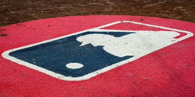 A general view of the MLB logo in the cover circle during the game between the New York Mets and Cincinnati Reds at Great American Ball Park on July 5, 2022 in Cincinnati.