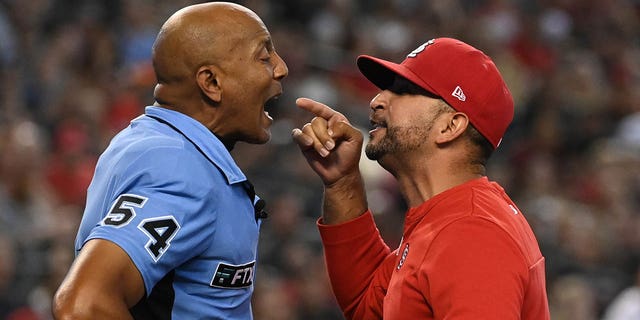 St. Louis Cardinals manager Oliver Marmol, right, argues with home plate umpire CB Bucknor after being ejected during the third inning of a game against the Arizona Diamondbacks at Chase Field on August 21, 2022 in Phoenix.
