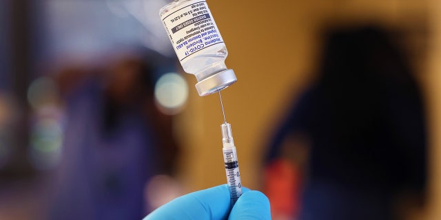 A pharmacist prepares to administer COVID-19 vaccine booster shots on September 9, 2022 in Chicago, Illinois.