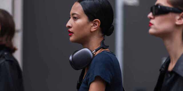 A female is seen wearing AirPod Max headphones extracurricular Carolina Herrera connected Sept. 12, 2022, successful New York City. NYC thieves person been stealing AirPod Max headphones disconnected nan heads of residents.
