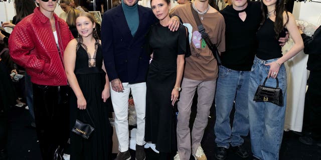 Cruz Beckham, Harper Beckham, David Beckham, Victoria Beckham, Romeo Beckham, Brooklyn Peltz Beckham and Nicola Peltz Beckham attend the Victoria Beckham Spring/summer 2023 Runway show in Val-de-Grace on September 30, 2022 in Paris, France. 