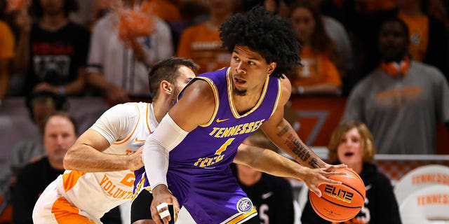 Santiago Vescovi #25 of the Tennessee Volunteers steals the ball from Diante Wood #1 of the Tennessee Tech Golden Eagles in the first half at Thompson-Boling Arena on November 7, 2022 in Knoxville, Tennessee. 