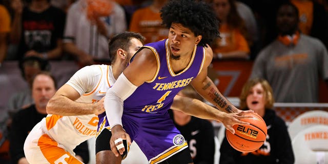 Santiago Vescovi #25 of the Tennessee Volunteers steals the ball from Diante Wood #1 of the Tennessee Tech Golden Eagles in the first half at Thompson-Boling Arena on November 07, 2022 in Knoxville, Tennessee.