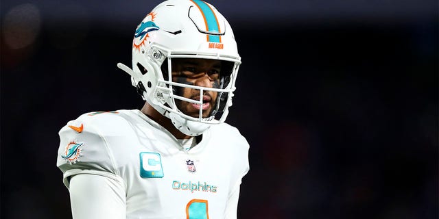 Tua Tagovailoa #1 of the Miami Dolphins reacts after a play during an NFL football game against the Buffalo Bills at Highmark Stadium on December 17, 2022 in Orchard Park, New York. 