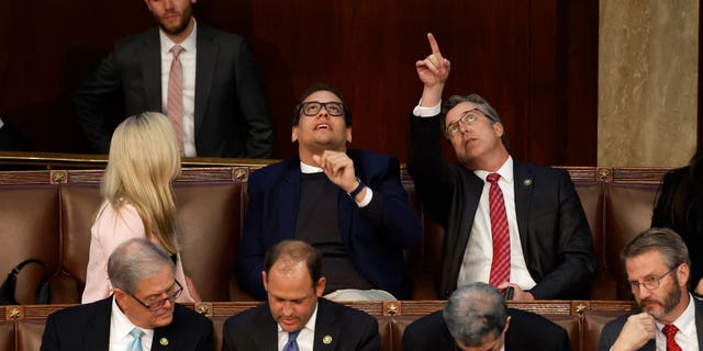 From left: U.S. Rep.-elect Marjorie Taylor Greene, R-Ga.; Rep.-elect George Santos, R-N,Y.; and Rep.-elect Andy Ogles, R-Tenn., talk in the House Chamber during the third day of elections for speaker of the House at the U.S. Capitol Building in Washington, D.C., on Jan. 5, 2022.