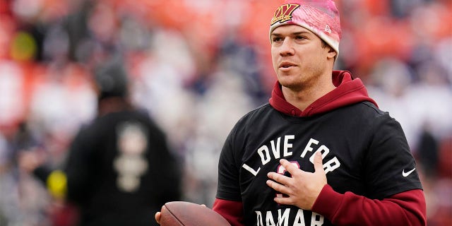Quarterback Taylor Heinicke of the Washington Commanders warms up prior to a game against the Dallas Cowboys at FedExField Jan. 8, 2023, in Landover, Md.