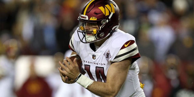 Quarterback Sam Howell of the Washington Commanders runs with the ball against the Dallas Cowboys at FedExField Jan. 8, 2023, in Landover, Md.