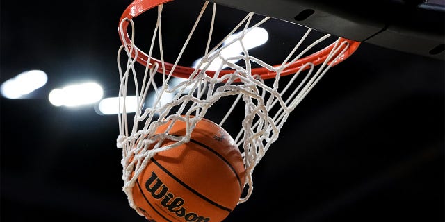 A basketball goes through the hoop during the game between the Memphis Tigers and the Cincinnati Bearcats at Fifth Third Arena on January 22, 2023, in Cincinnati, Ohio.