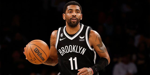 Kyrie Irving #11 of the Brooklyn Nets dribbles during the second half against the Los Angeles Lakers at Barclays Center on January 30, 2023 in the Brooklyn borough of New York City.  The Nets won 121-104. 
