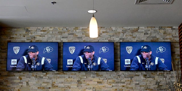 Colorado Buffaloes head football coach Deion Sanders, seen here on monitors,  speaks to members of the media about National Signing Day during a press conference at the Dal Ward Athletic Center in Boulder on Wednesday, Feb. 1, 2023. Sanders spoke about signing new players to the football team for the upcoming season.