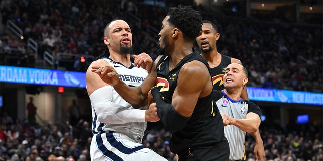 Dillon Brooks, #24 of the Memphis Grizzlies, fights with Donovan Mitchell, #45 of the Cleveland Cavaliers, during the third quarter at Rocket Mortgage Fieldhouse on Feb. 2, 2023 in Cleveland. Both players were ejected.The Cavaliers defeated the Grizzlies 128-113. 