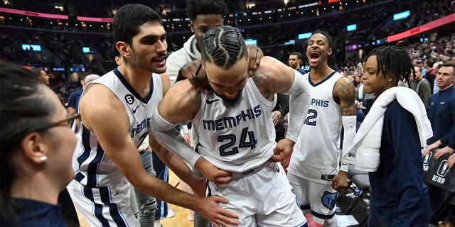 Teammates joke with Dillon Brooks, #24 of the Memphis Grizzlies, after her was ejected for fighting with Donovan Mitchell, #45 of the Cleveland Cavaliers, during the third quarter at Rocket Mortgage Fieldhouse on Feb. 2, 2023 in Cleveland. The Cavaliers defeated the Grizzlies 128-113.