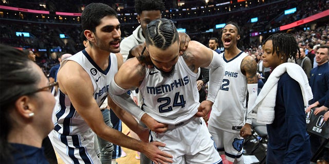 Teammates joke with Dillon Brooks, #24 of the Memphis Grizzlies, after her was ejected for fighting with Donovan Mitchell, #45 of the Cleveland Cavaliers, during the third quarter at Rocket Mortgage Fieldhouse on Feb. 2, 2023 in Cleveland. The Cavaliers defeated the Grizzlies 128-113. 