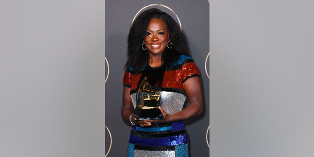 Viola Davis celebrates the best audiobook, narration and storytelling award for "Finding Me" at the Grammy Awards on Sunday.