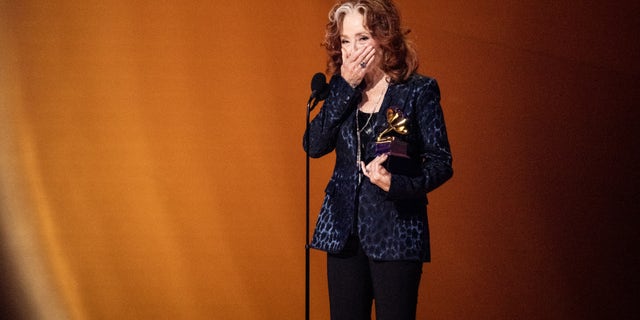 Bonnie Raitt accepts her surprise song of the year Grammy at the 2023 Grammy Awards.