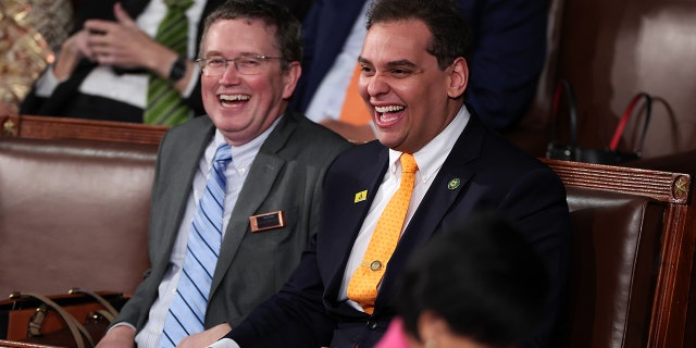 Rep. George Santos of New York State laughs with Rep. Thomas Massey of Kentucky ahead of President Joe Biden's State of the Union address February 7, 2023 in Washington, DC.