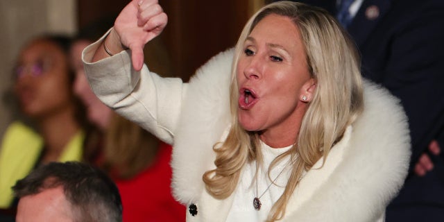 Rep. Marjorie Taylor Greene, R-Ga., gives a thumbs down during President Joe Biden's State of the Union address during a joint meeting of Congress in the House Chamber of the U.S. Capitol on February 07, 2023 in Washington, DC. The speech marks Biden's first address to the new Republican-controlled House.