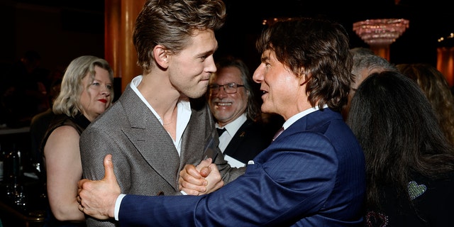 Austin Butler and Tom Cruise have a chat at the 95th Annual Oscars Nominees Luncheon.