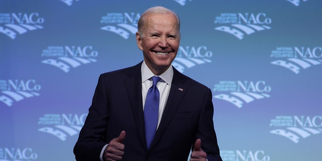 U.S. President Joe Biden gestures as he delivers remarks at the National Association of Counties legislative conference at the Washington Hilton Hotel on February 14, 2023, in Washington, DC. 